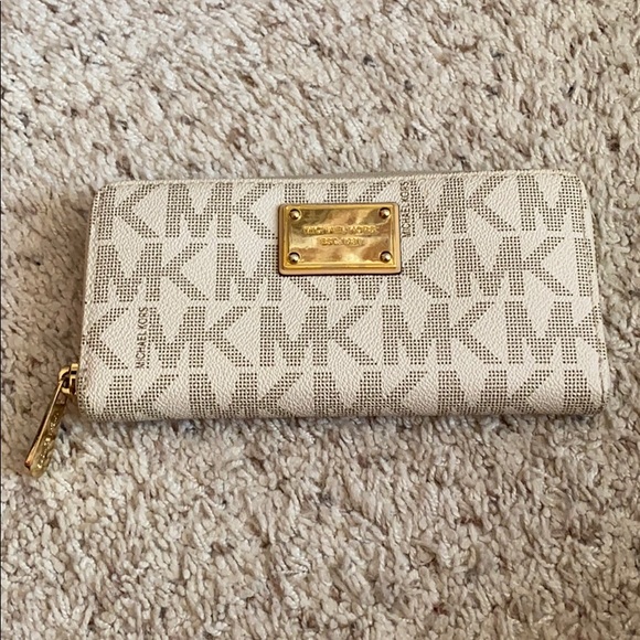 Michael Kors | Bags | Michael Kors Cream Monogram Zip Around Wallet ...